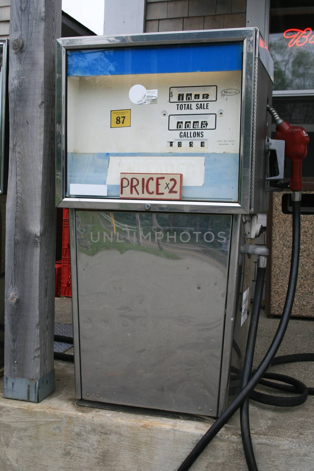 an antiquated gas pump at a small country store - so out-of-date that customers must double to price shown on the pump tp be accurate