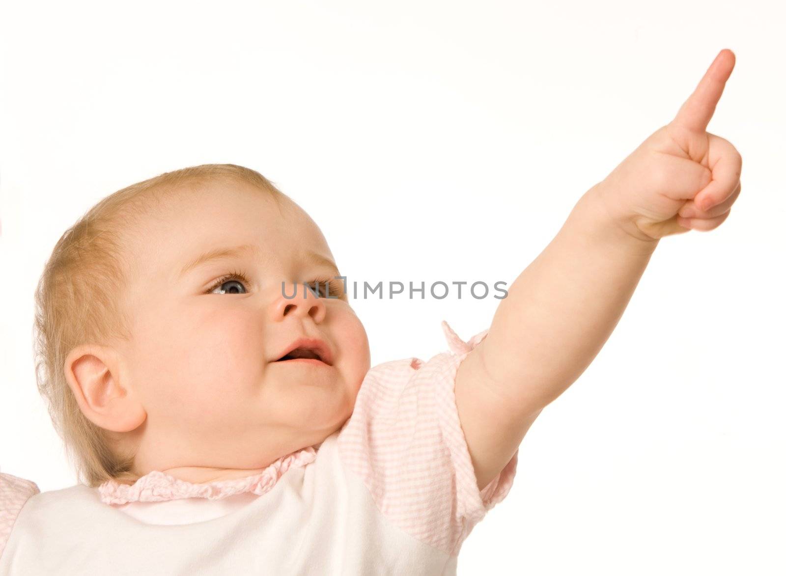 Small nice girl shows a finger upwards on a white background
