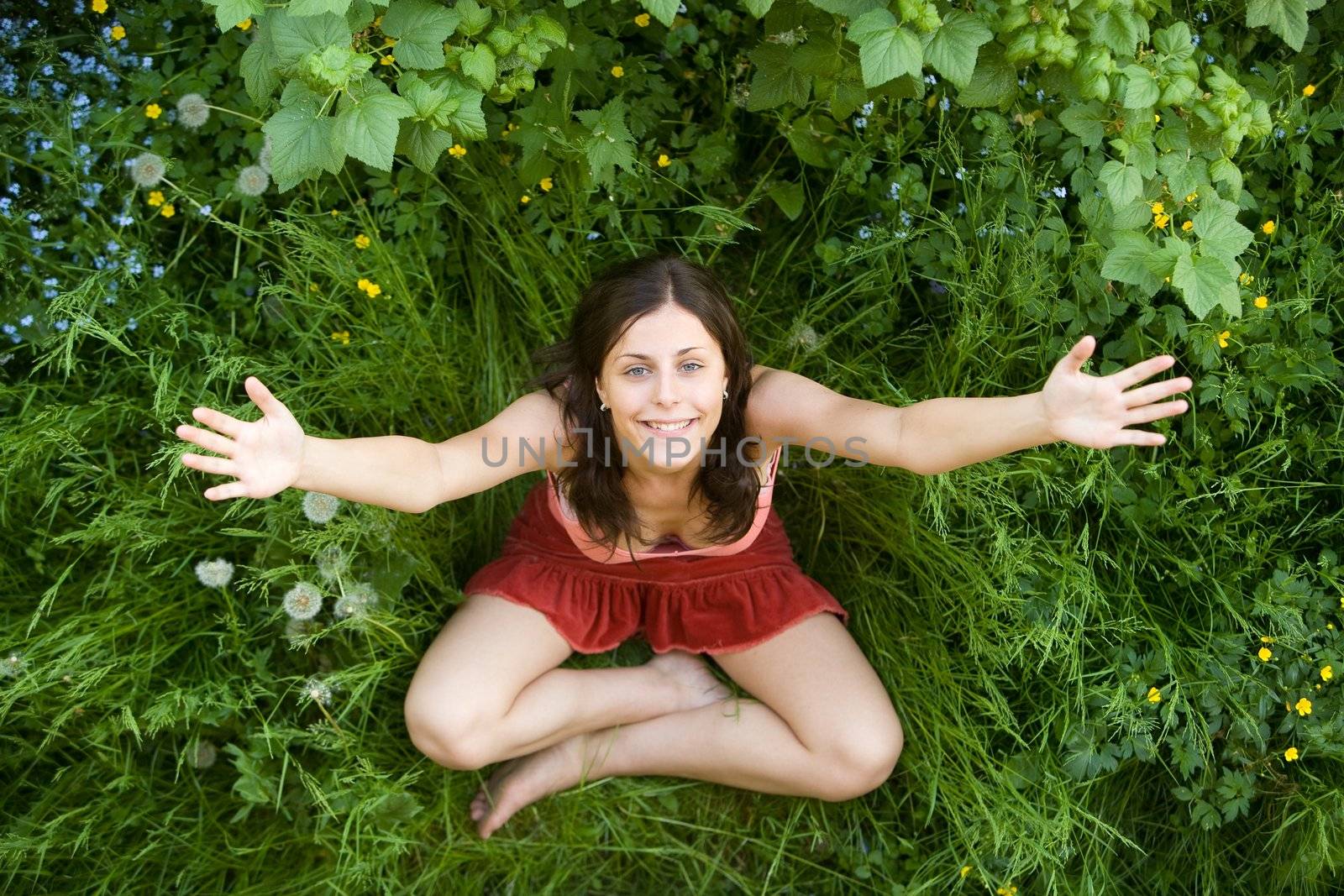 Young girl on a grass by Gravicapa