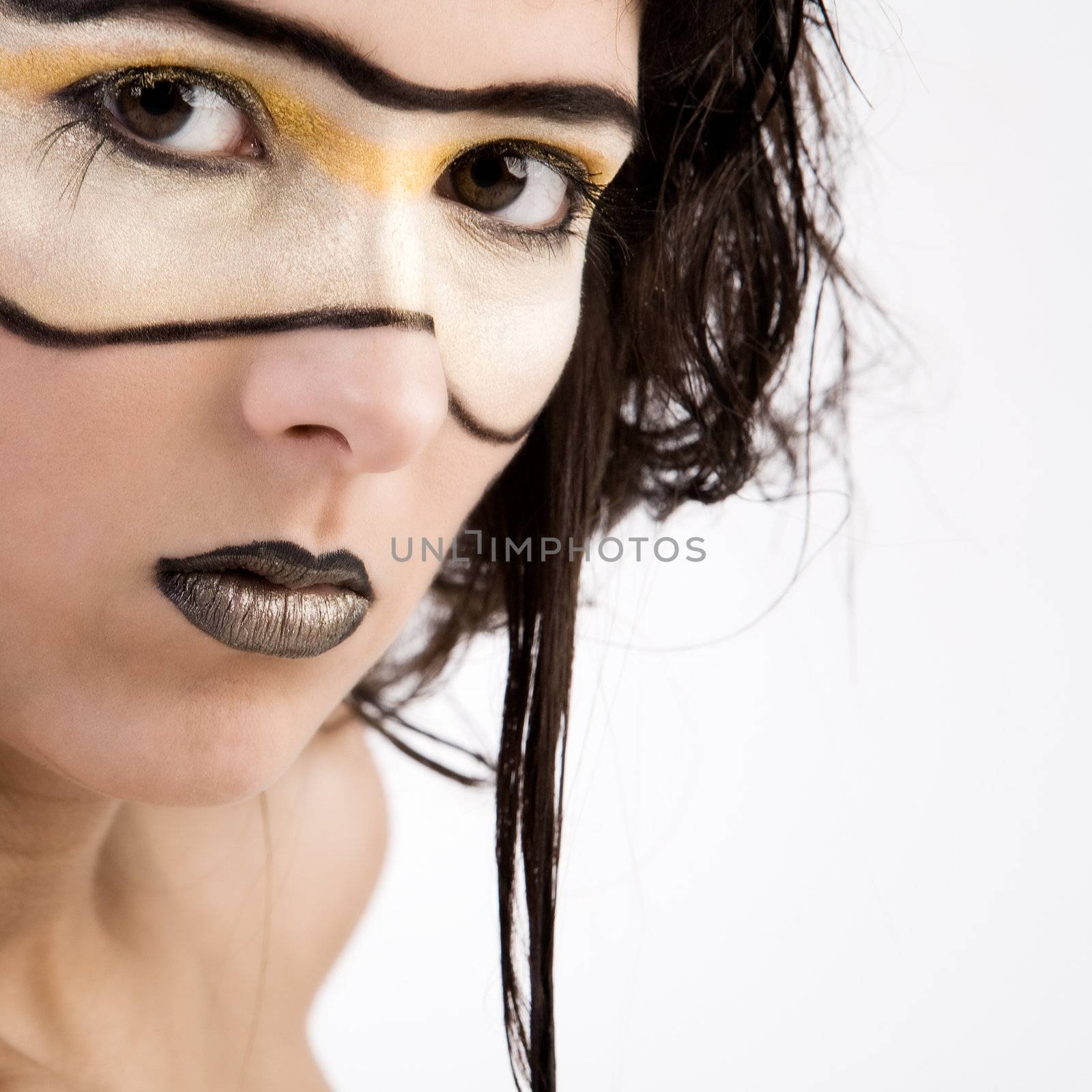 Young girl with fantasy make-up as if she's from the future