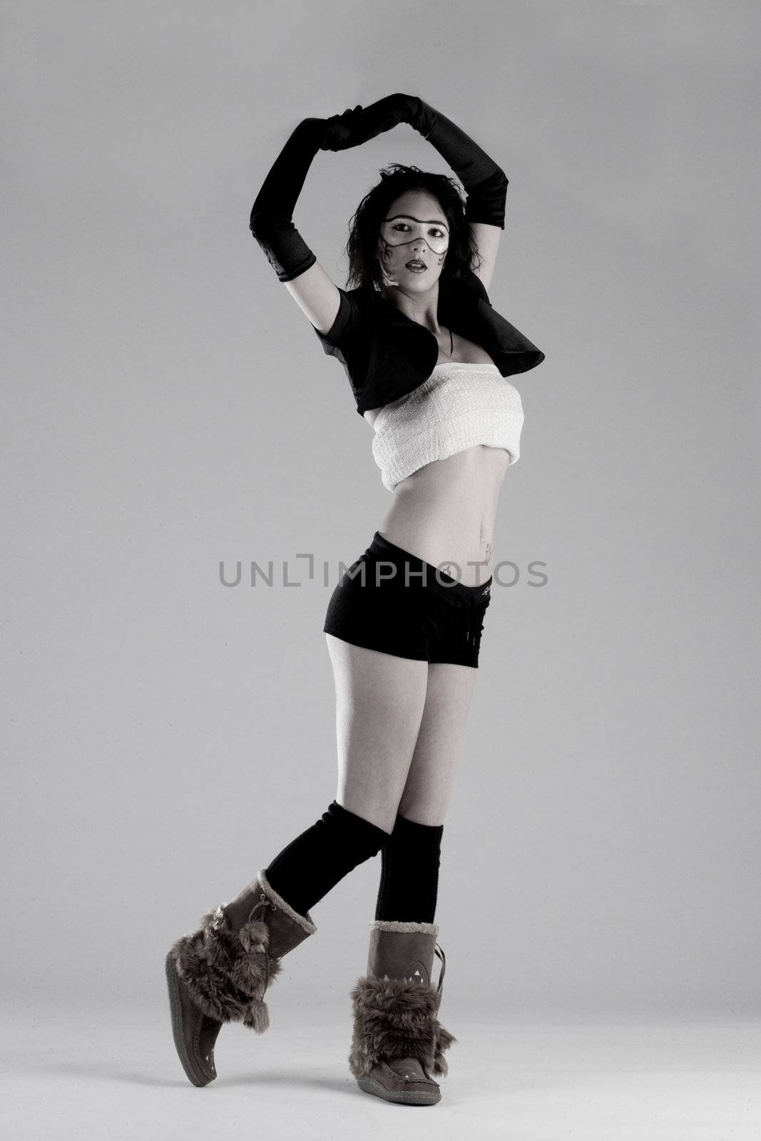 Young brunette in extreme high fashion pose