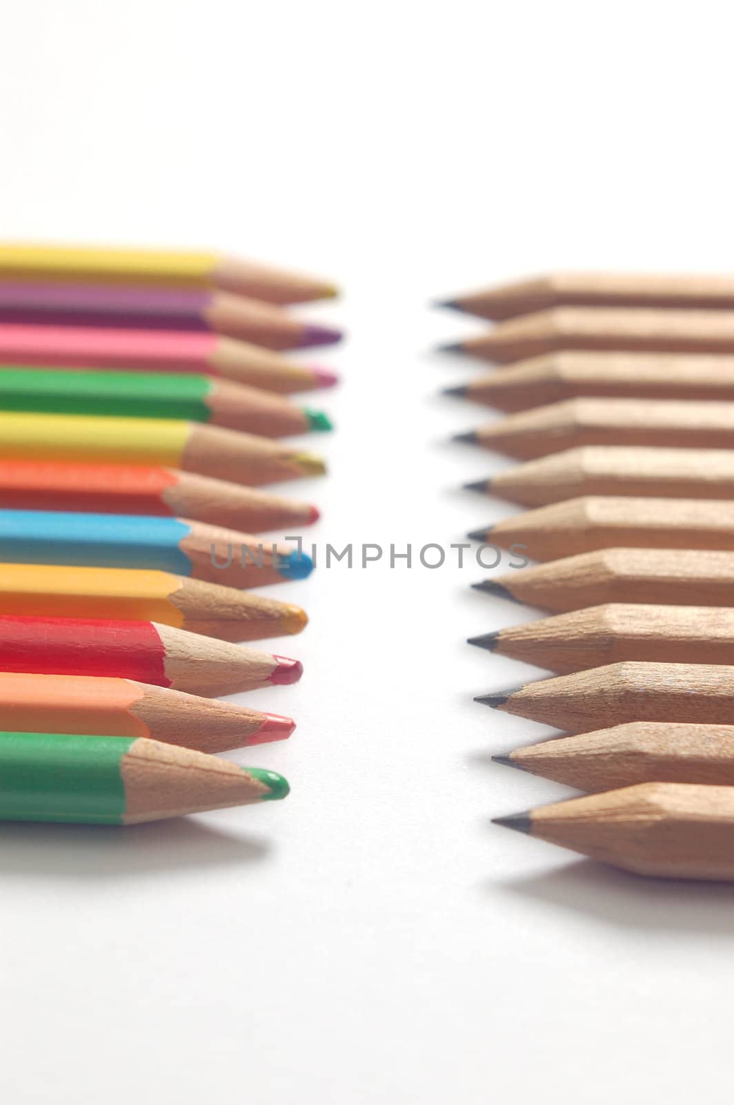 pencils and crayons on a white background