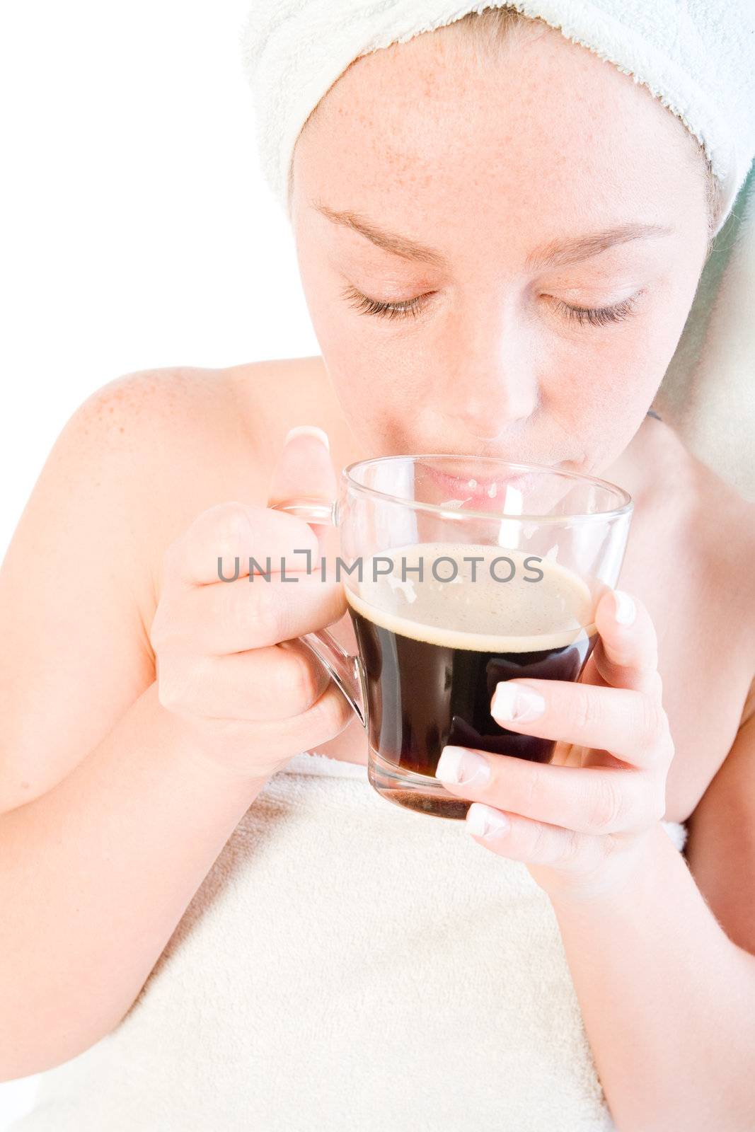Studio portrait of a spa girl smelling her coffee