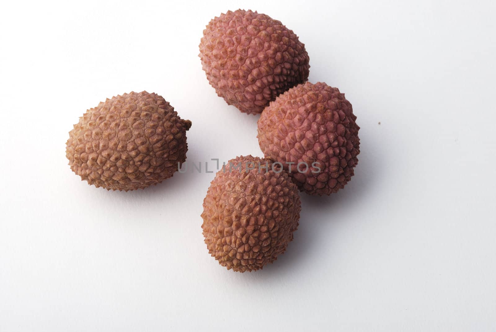 litchis on a white background