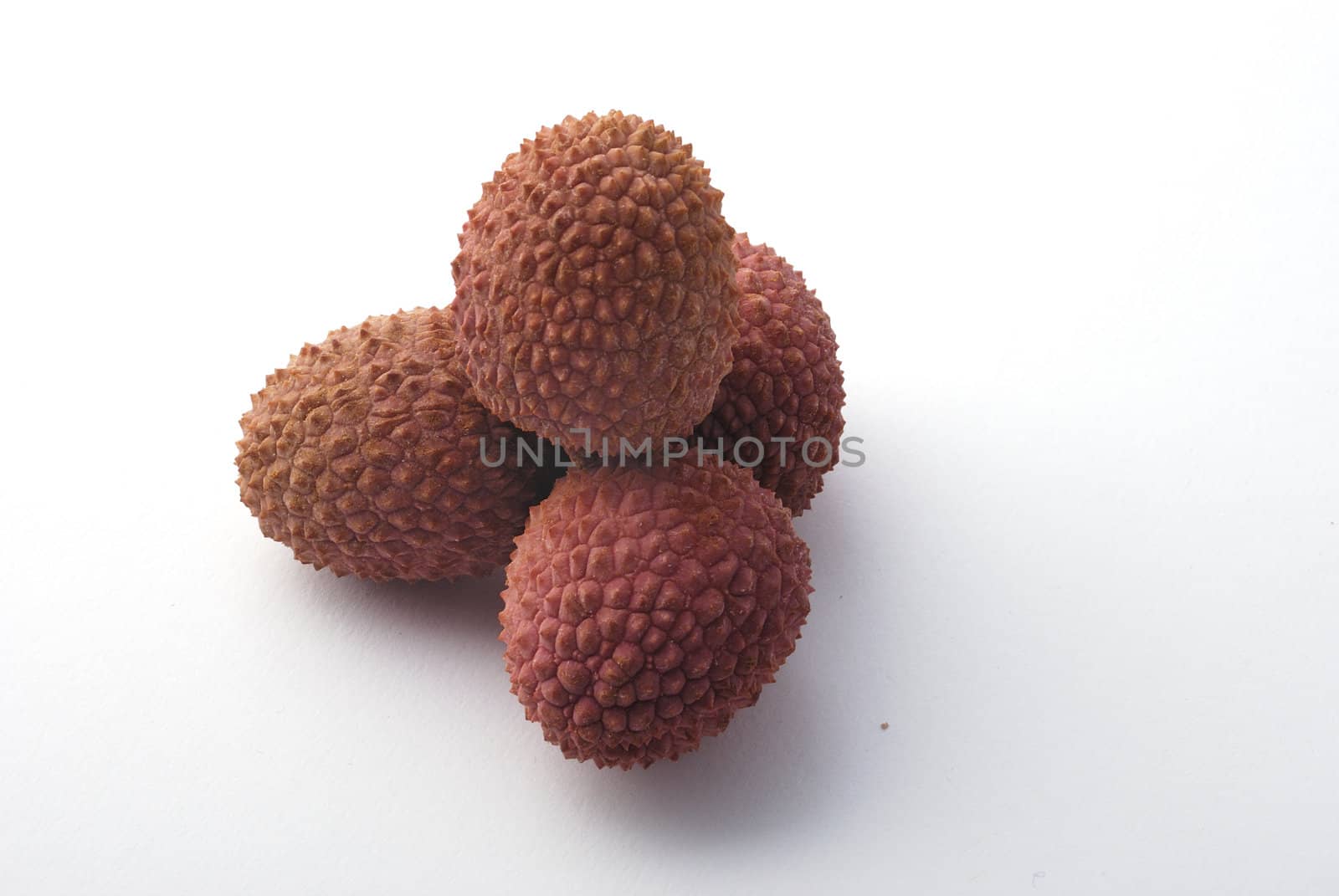litchis on a white background