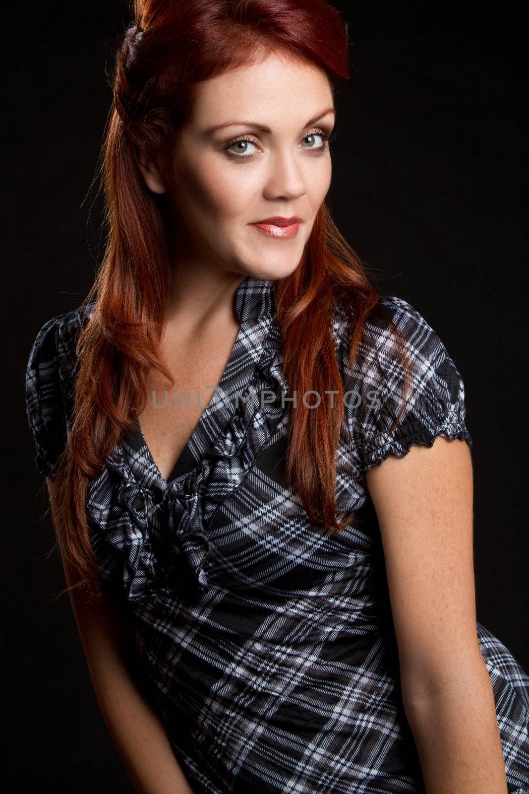 Beautiful young redhead woman smiling