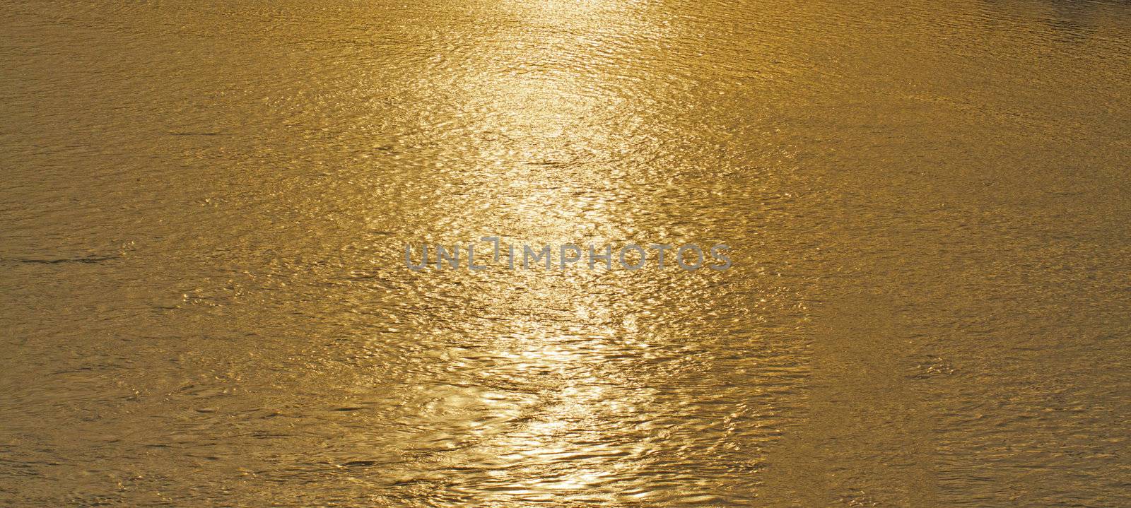 Close up of water of river at the sunset