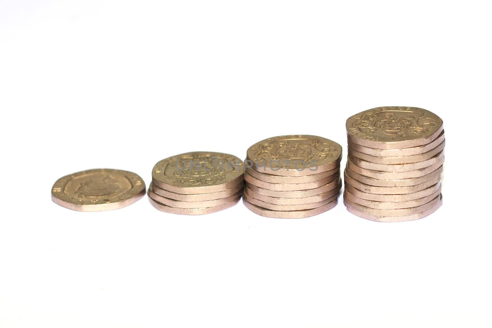Rising piles of twenty pence coins