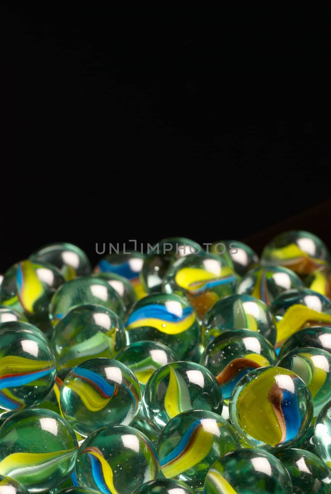 A heap of toy marbles with copy space