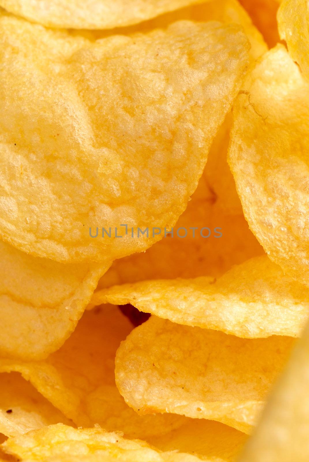 Closeup take of  a heap of potato crisps