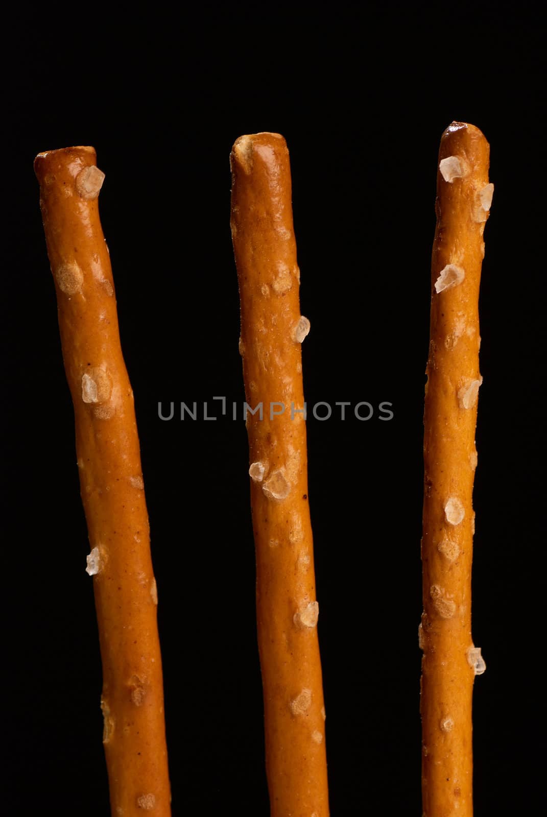 Crunchy salted sticks in vertical take, classic snack