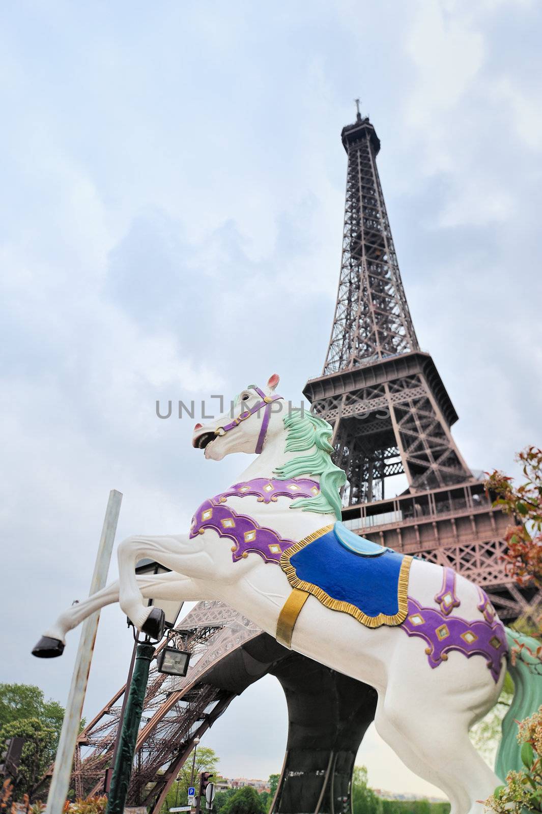 White horse on the carousel near the Eiffel Tower