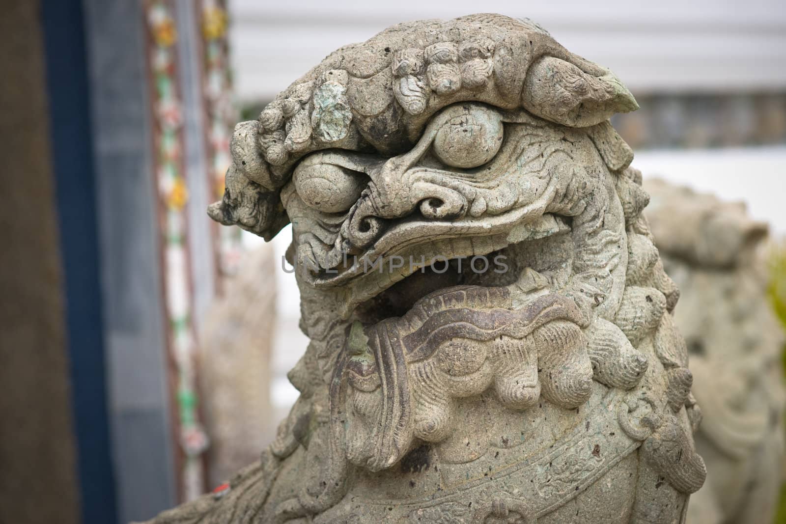 Stone monster with sphere in his mouth, Grand Palace, Bangkok, Thailand