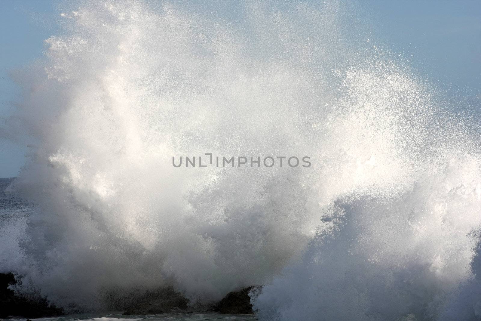 Big waves crashing into the rocks