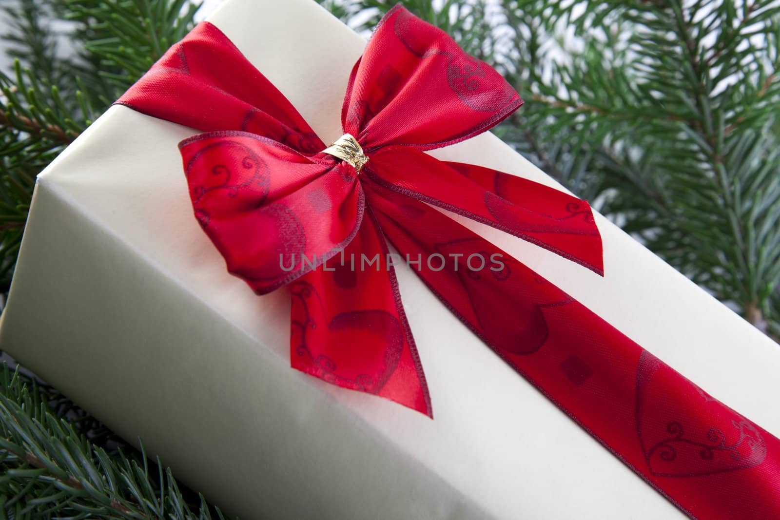 Christmas gift with red ribbon.