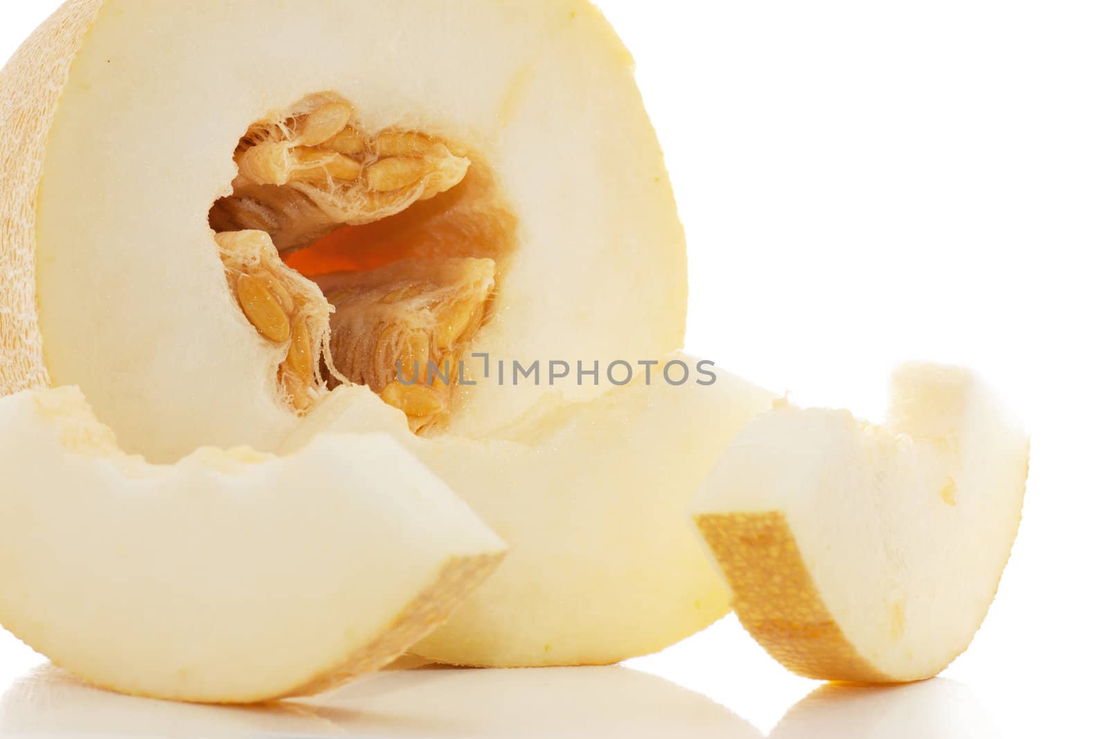 Pieces of juicy melon isolated over white