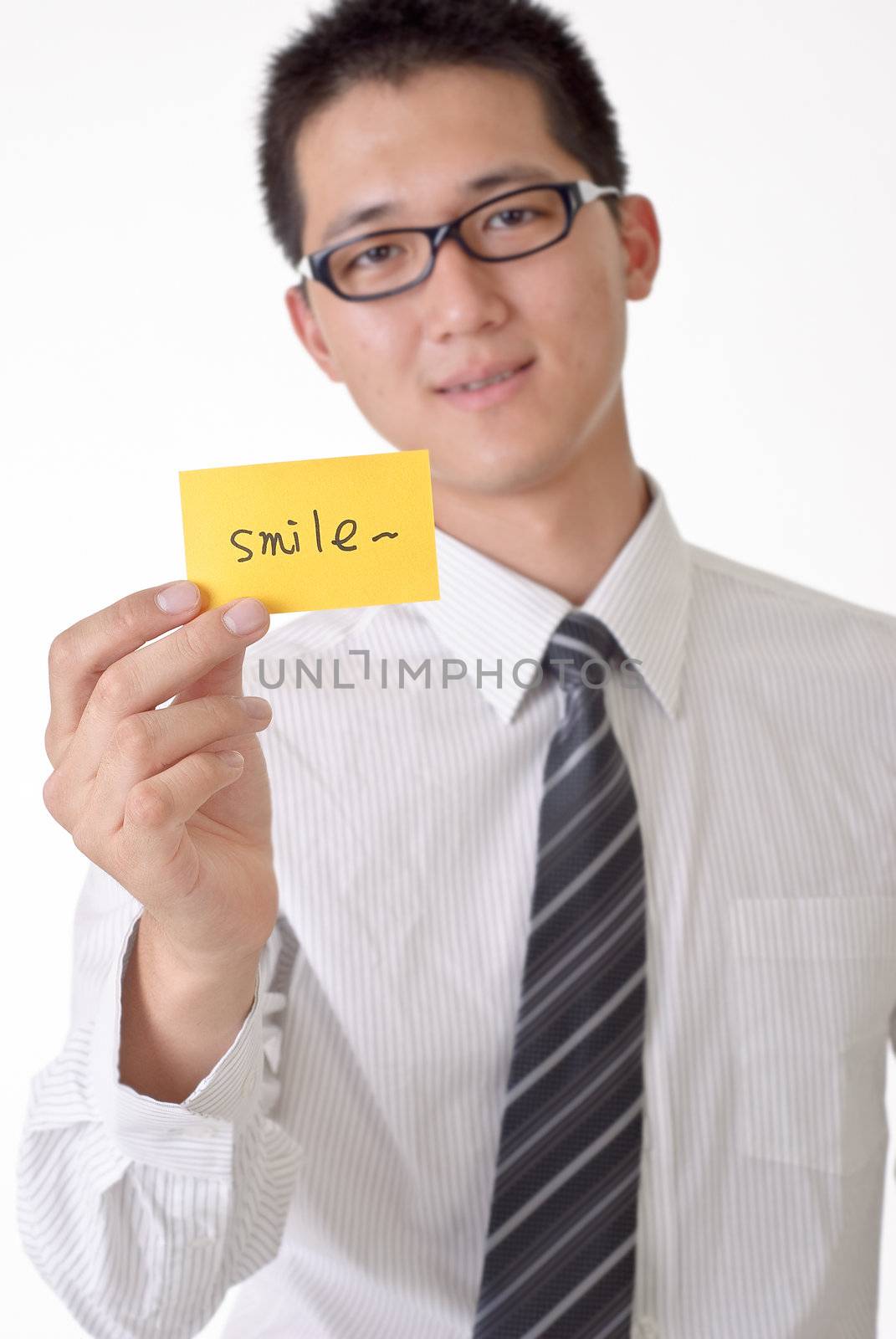 Smile card holding by happy business man, focus on yellow card.