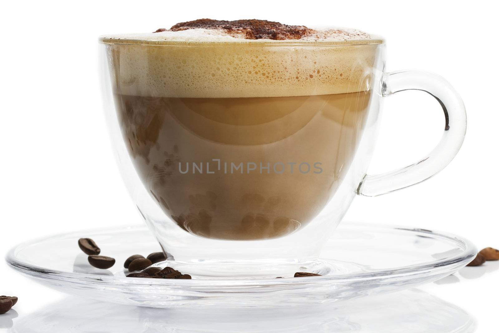 cappuccino in a glass cup with chocolate powder on white background