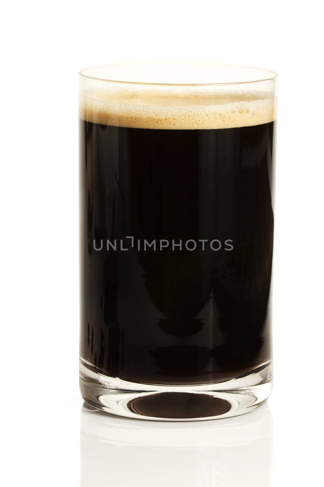 black espresso coffee with cream in a straight glass on white background