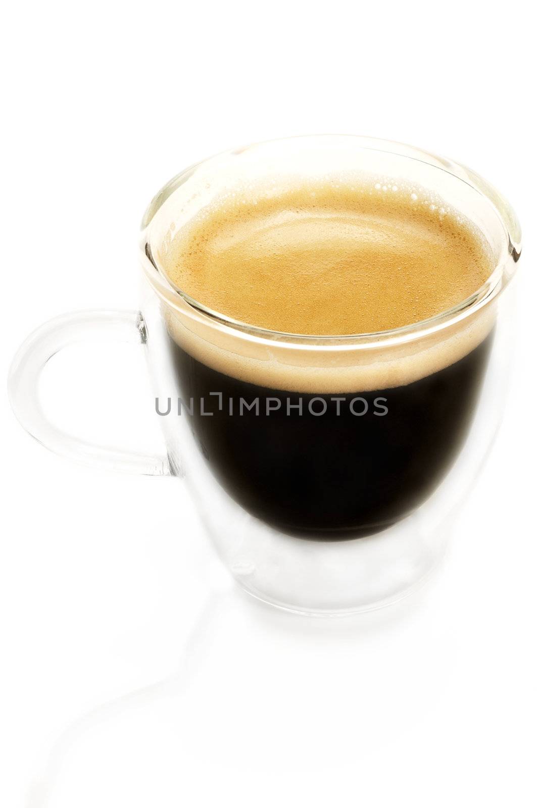 espresso coffee in a glass cup from slightly top on white background