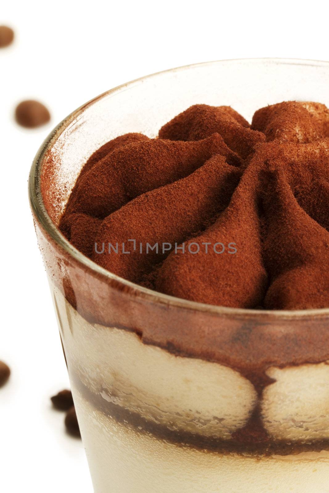 tiramisu soft focus closeup on white background with coffee beans