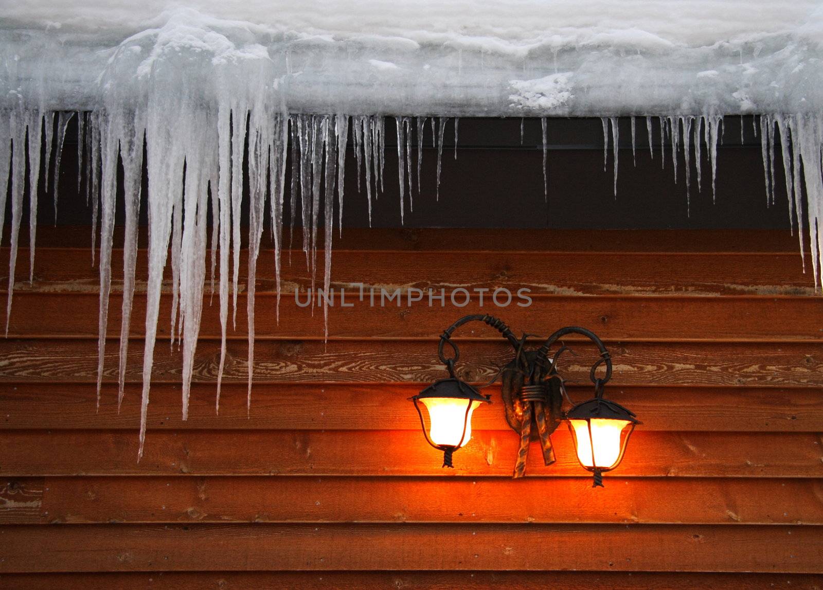 Icicles hanging from roof by Maridav