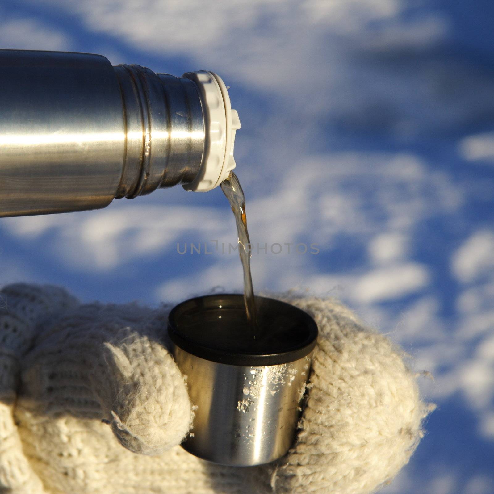 pouring tea outdoors by Maridav