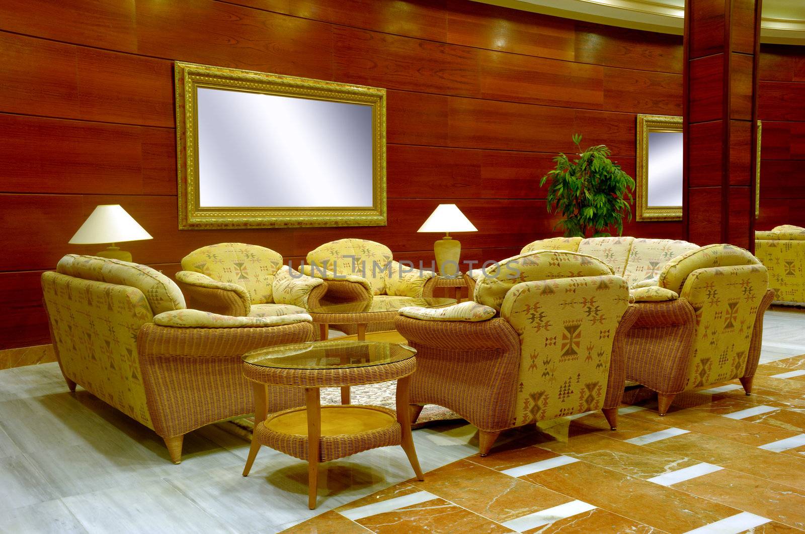 Hotel lobby whit table, chairs and sofas