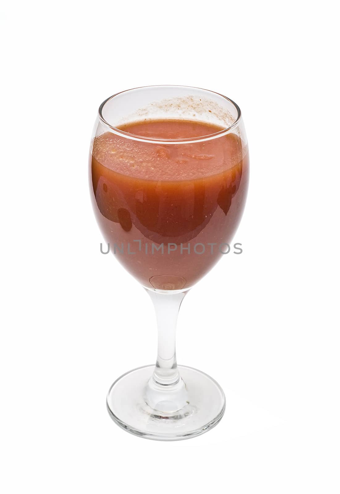 A cup of tomato juice on a white background.