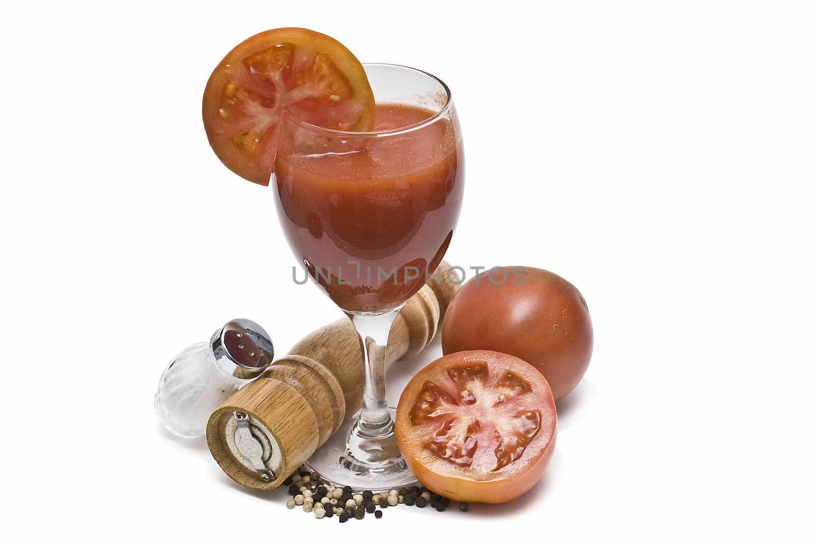 A cup of tomato juice on a white background.