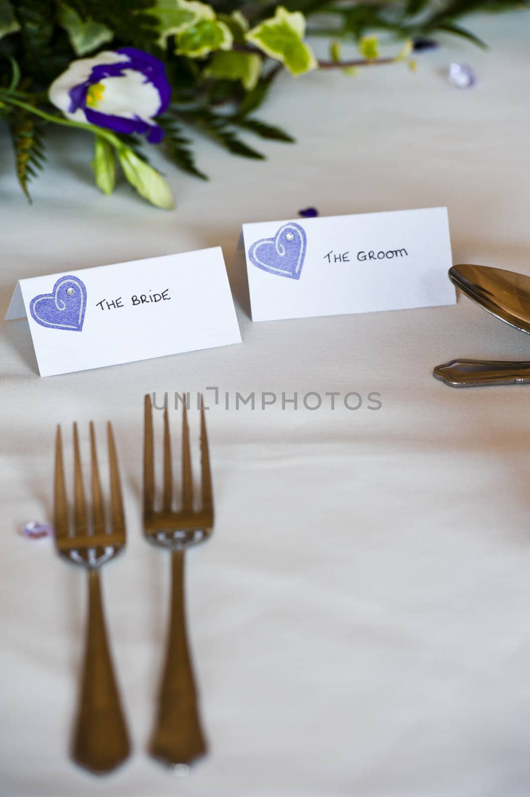 table setting at wedding breakfast with bride and groom tags