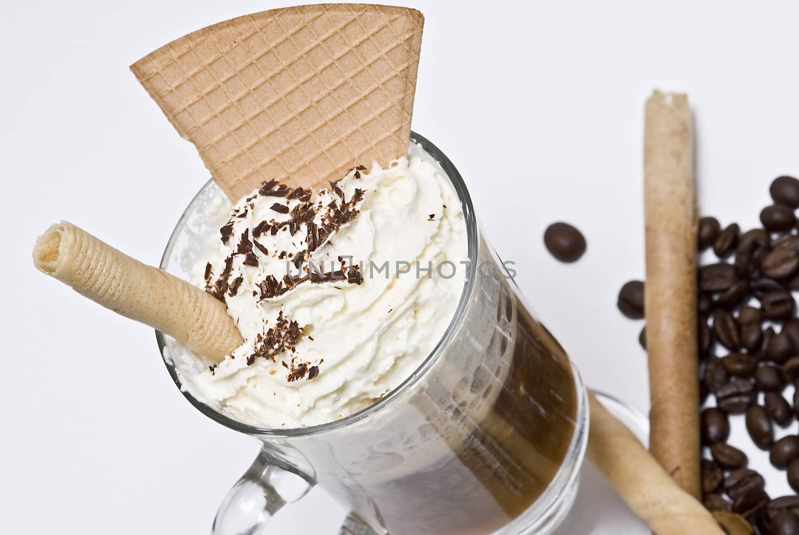 A cup of coffee with whipped cream on a white background.