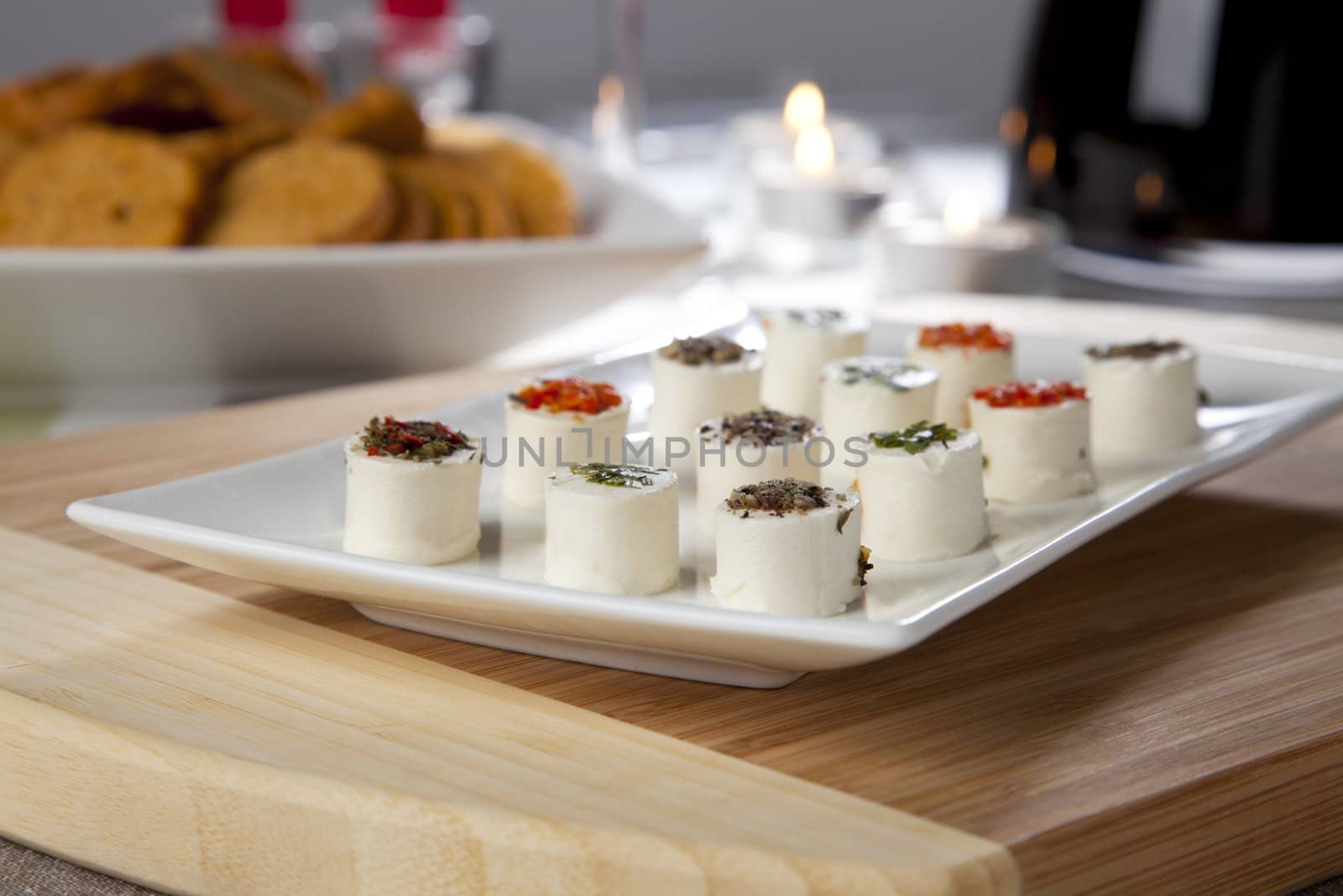 Platter of fresh cheese topped with spices.