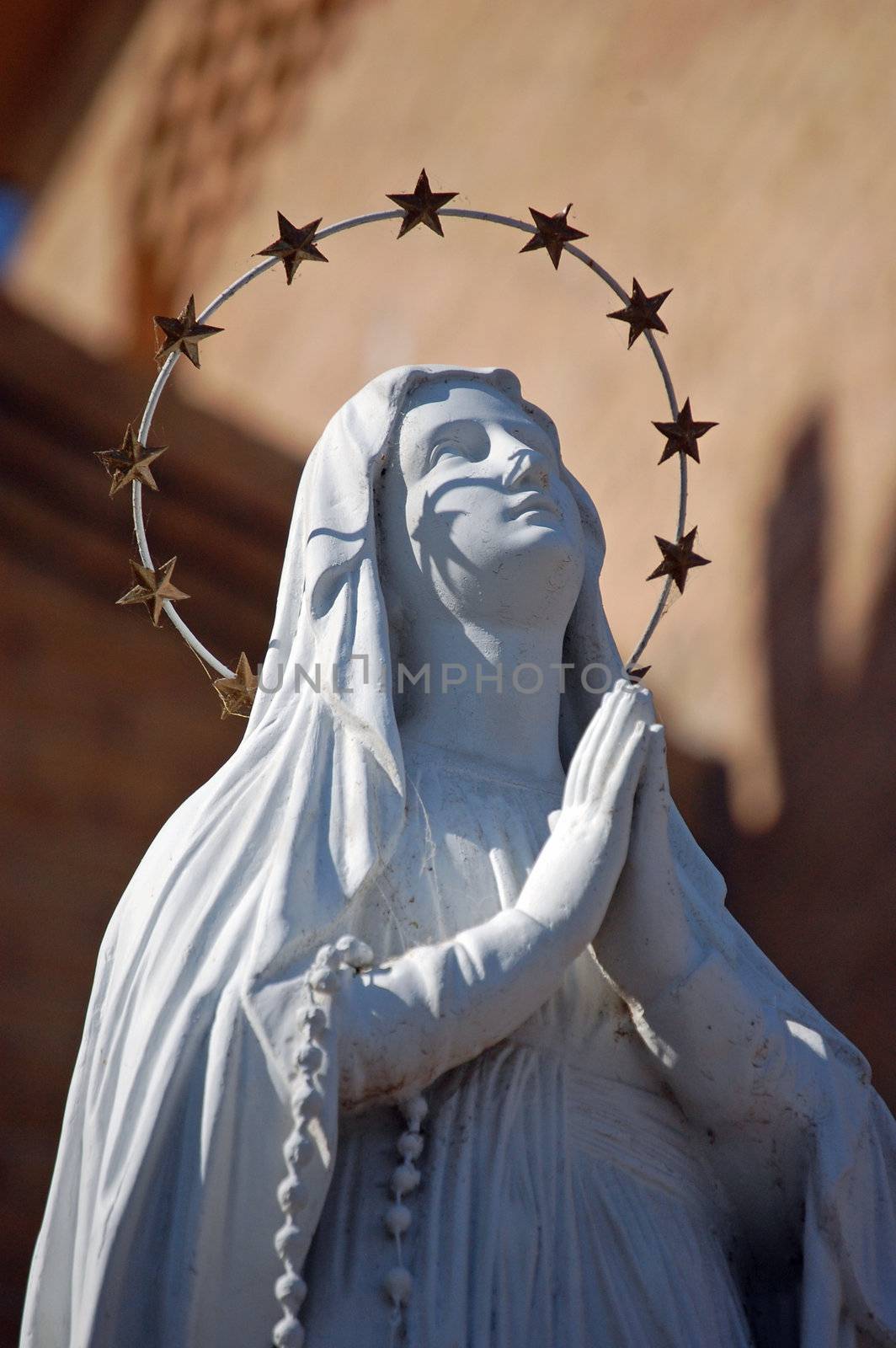 Statue of Mary Prays to God by RefocusPhoto