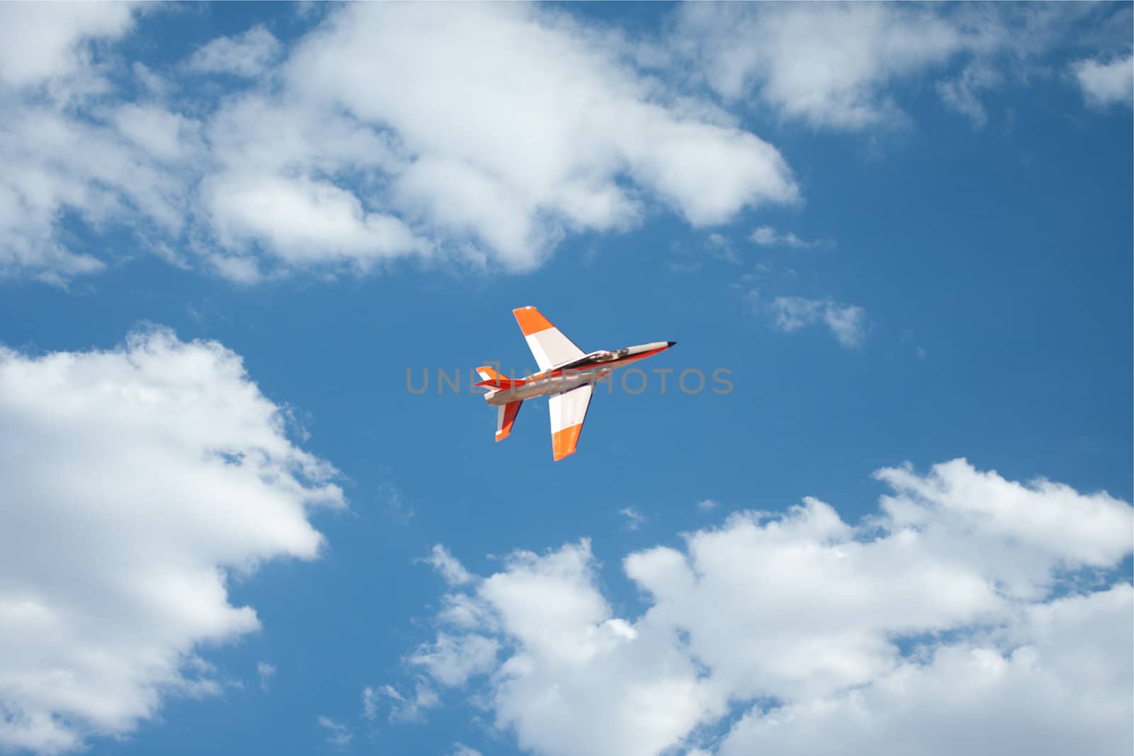 RC remote controlled Real Jet airplane model in action on blue sky
