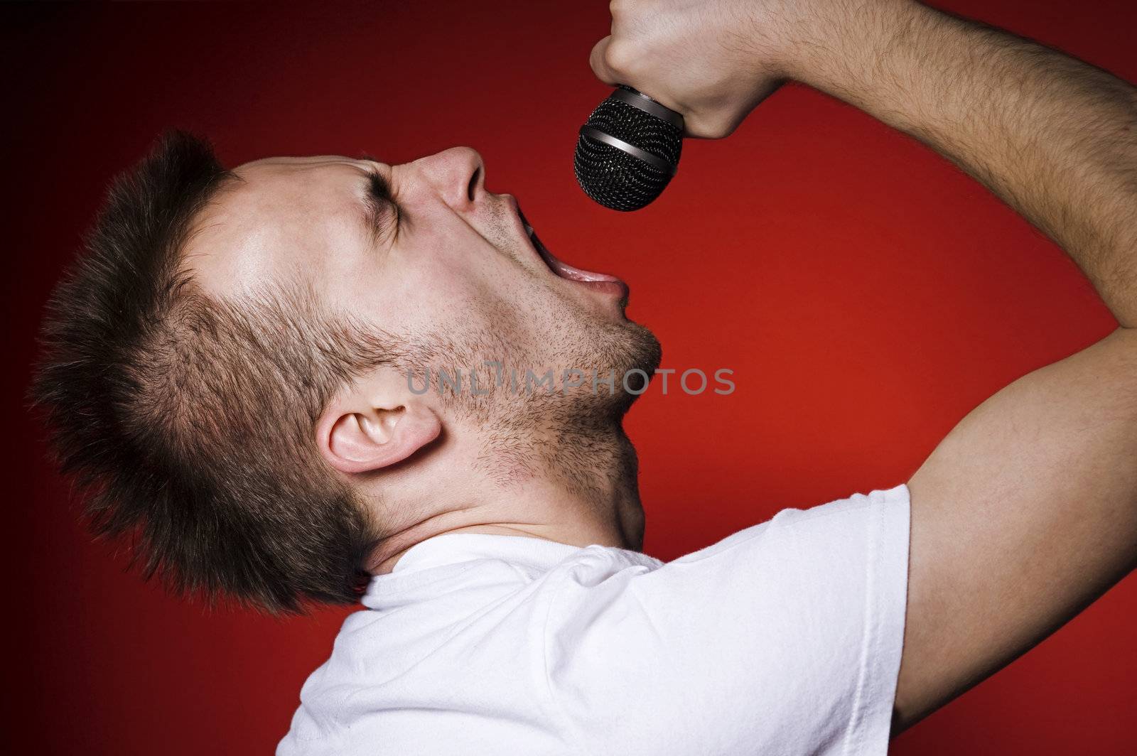young man screaming to the microphone