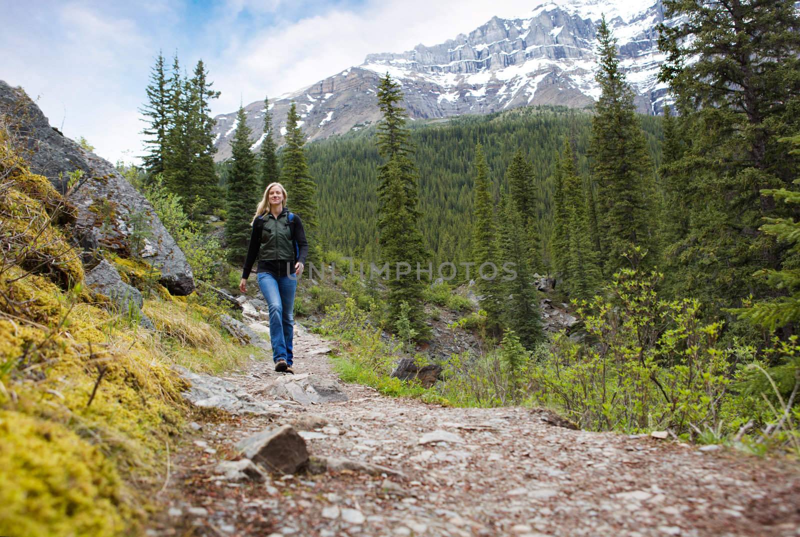 Happy Woman on Mountain Hike by leaf