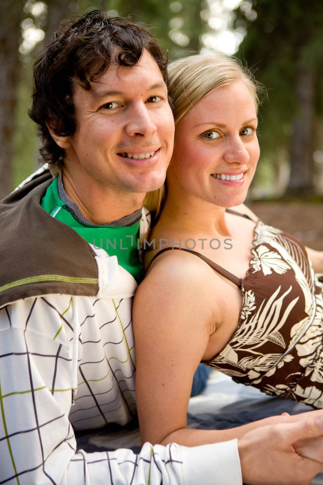 An outdoor portrait of a happy couple on a camping trip