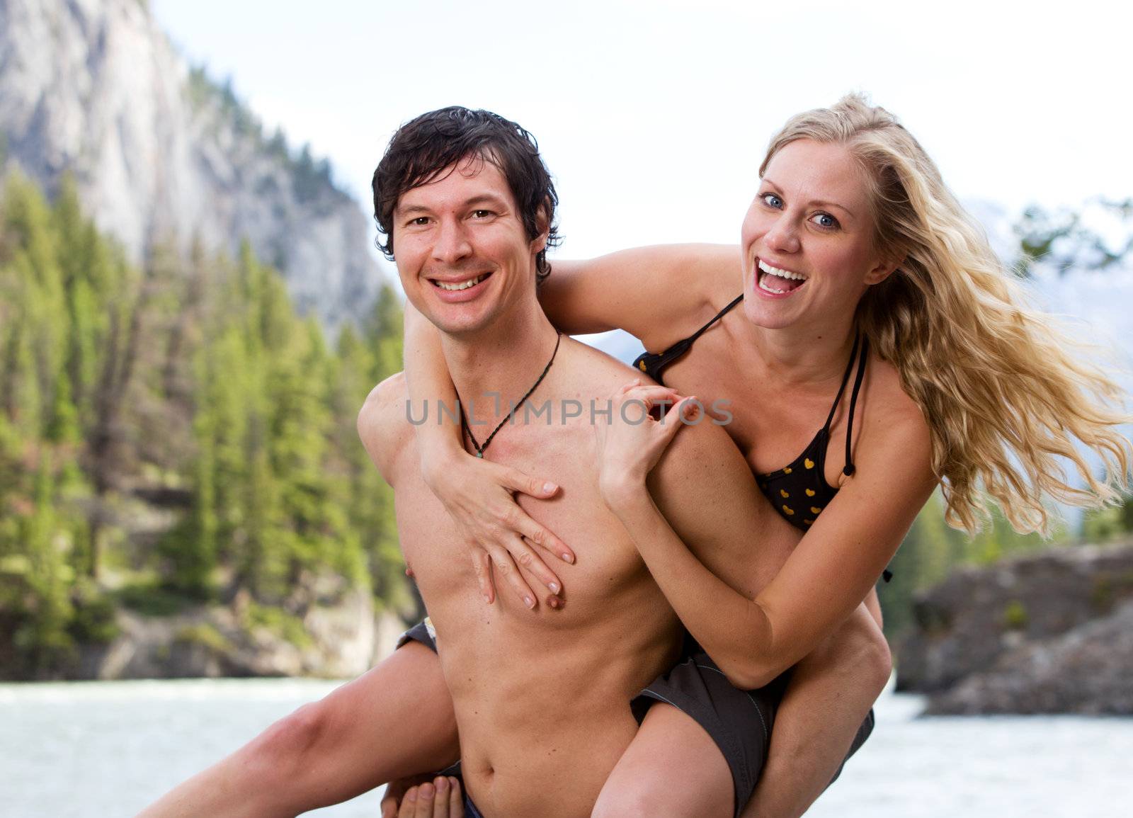 A playing couple at a scenic location in Banff