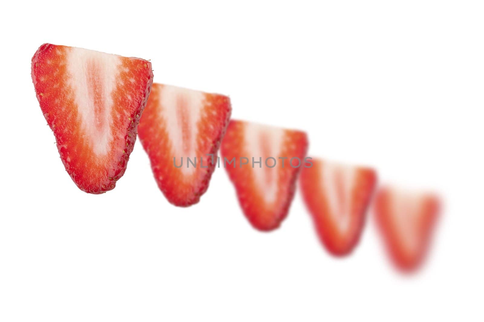 Strawberry slices moving off into distance. 