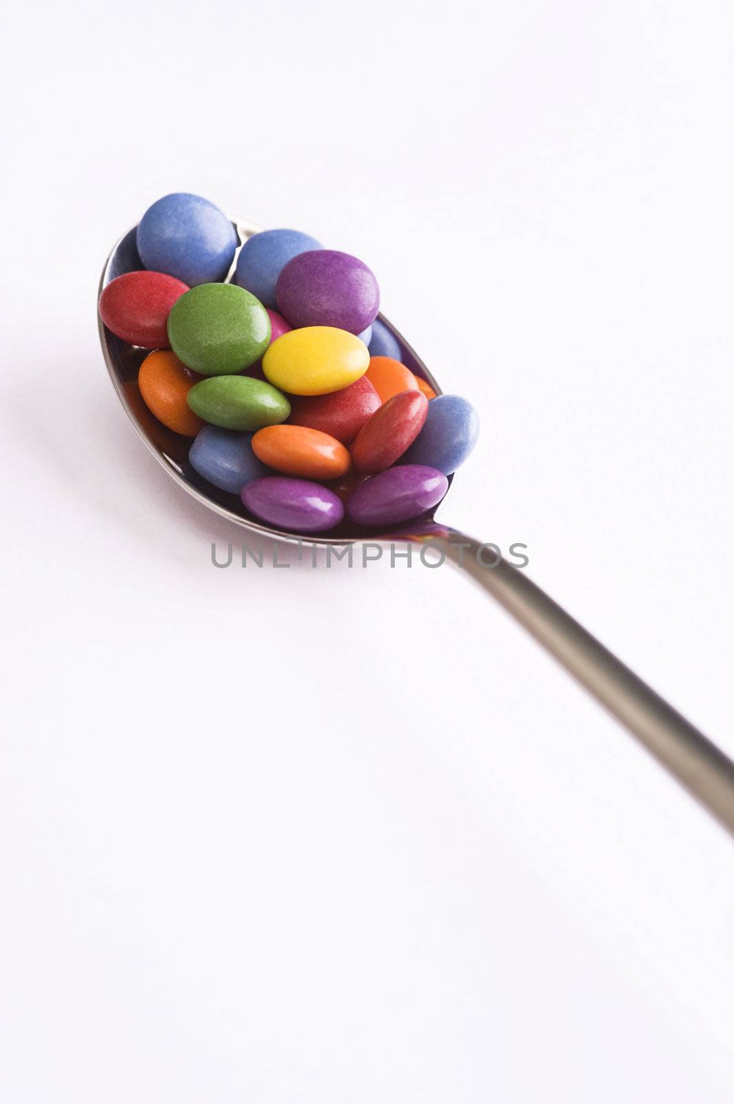 spoon with sweets by tiptoee