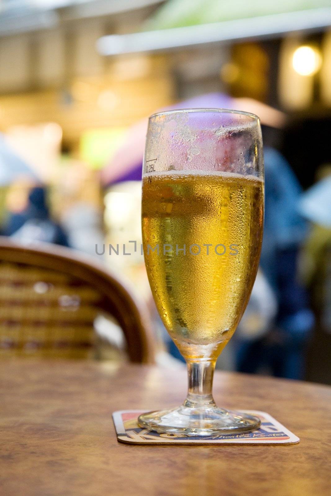 Frosted golden beer on the terrace