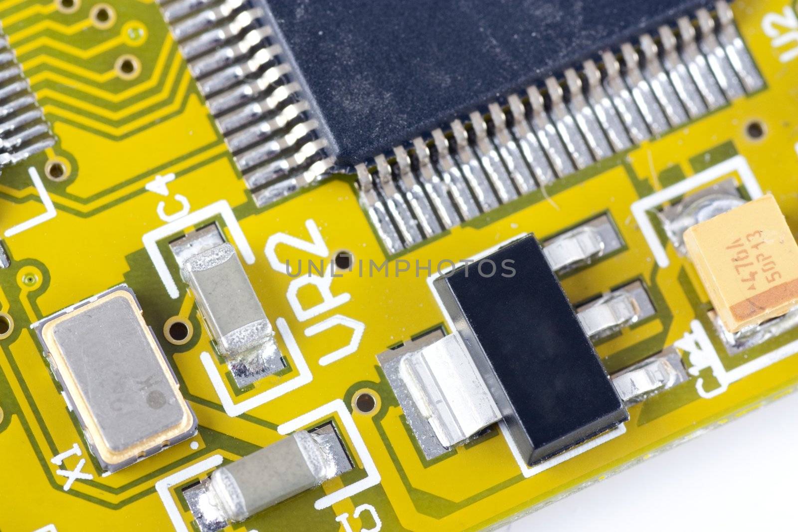 Closeup of circuit board showing circuits and microprocessor.  