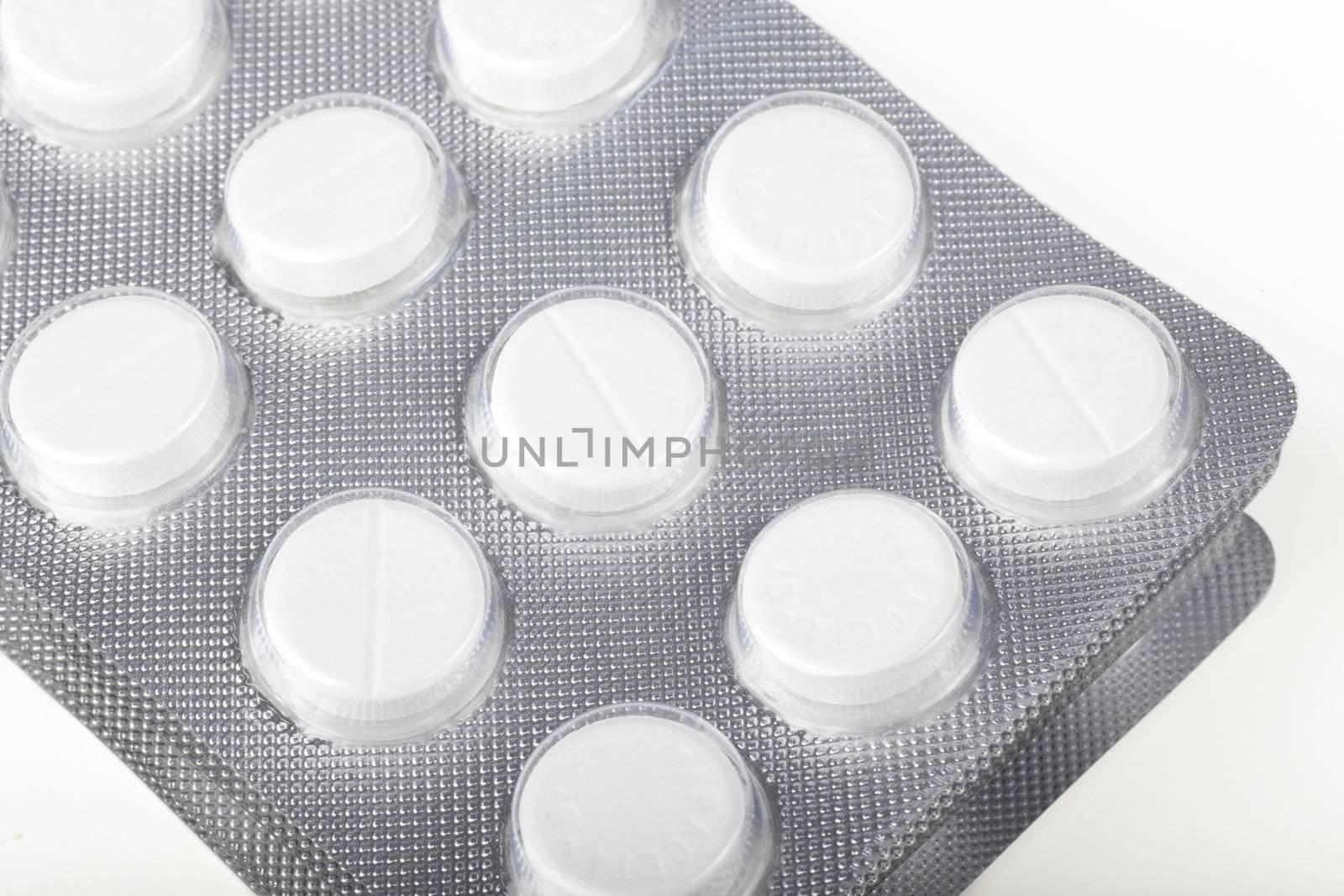 Paracetamol tablets in foil bubble packaging.