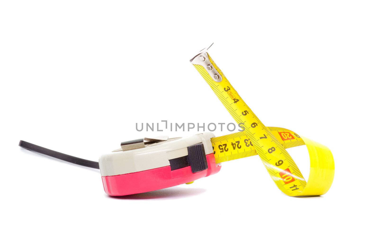 Tape measure curled on a white background
