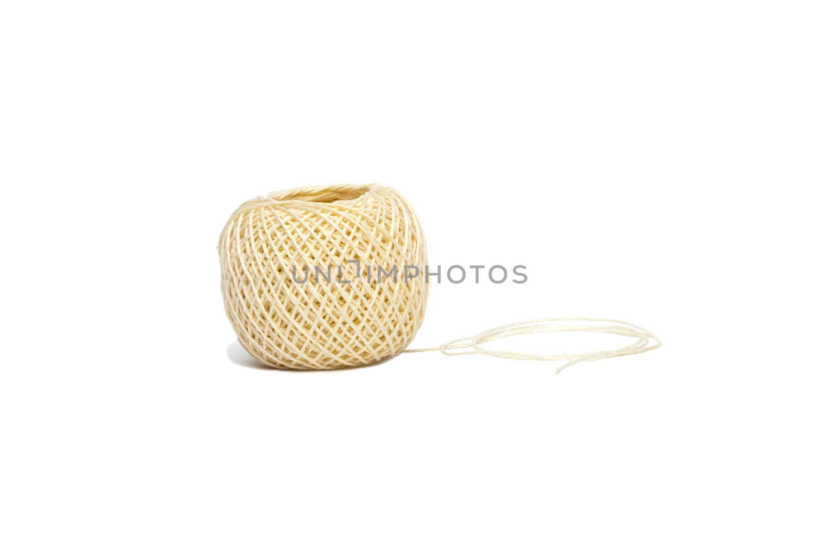 A ball of string unwinding partly on a white background