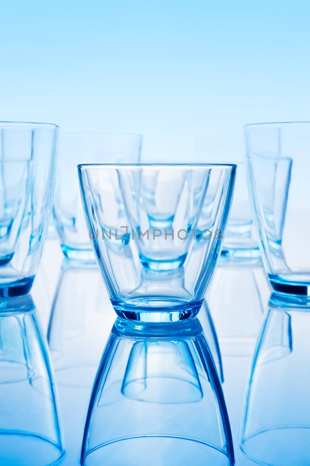 arranged  row of glasses with reflection