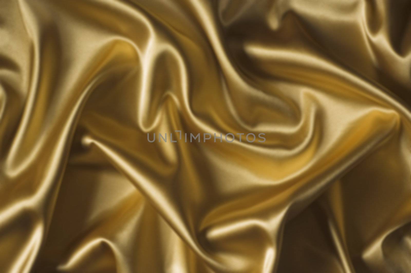 textile yellow silk backround draped in waves