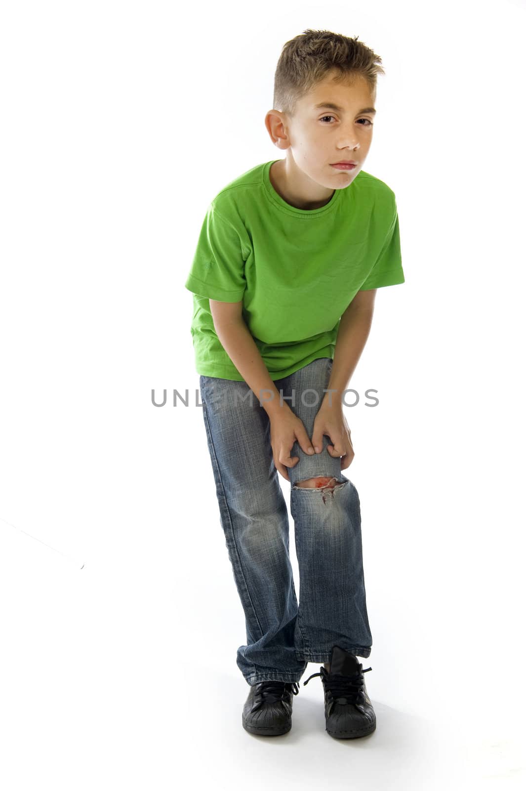 a young boy with a painful leg on white
