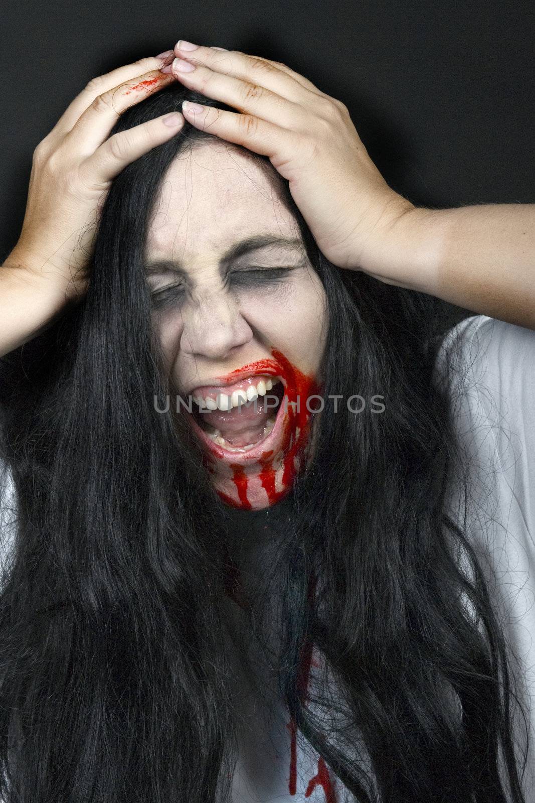 a screaming women, dressed for halloween